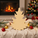 DIY MDF Christmas tree cutout for painting and holiday decor standing on table