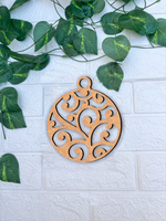 DIY MDF swirl bauble ornament cutout for painting and hanging decor mounted on wall