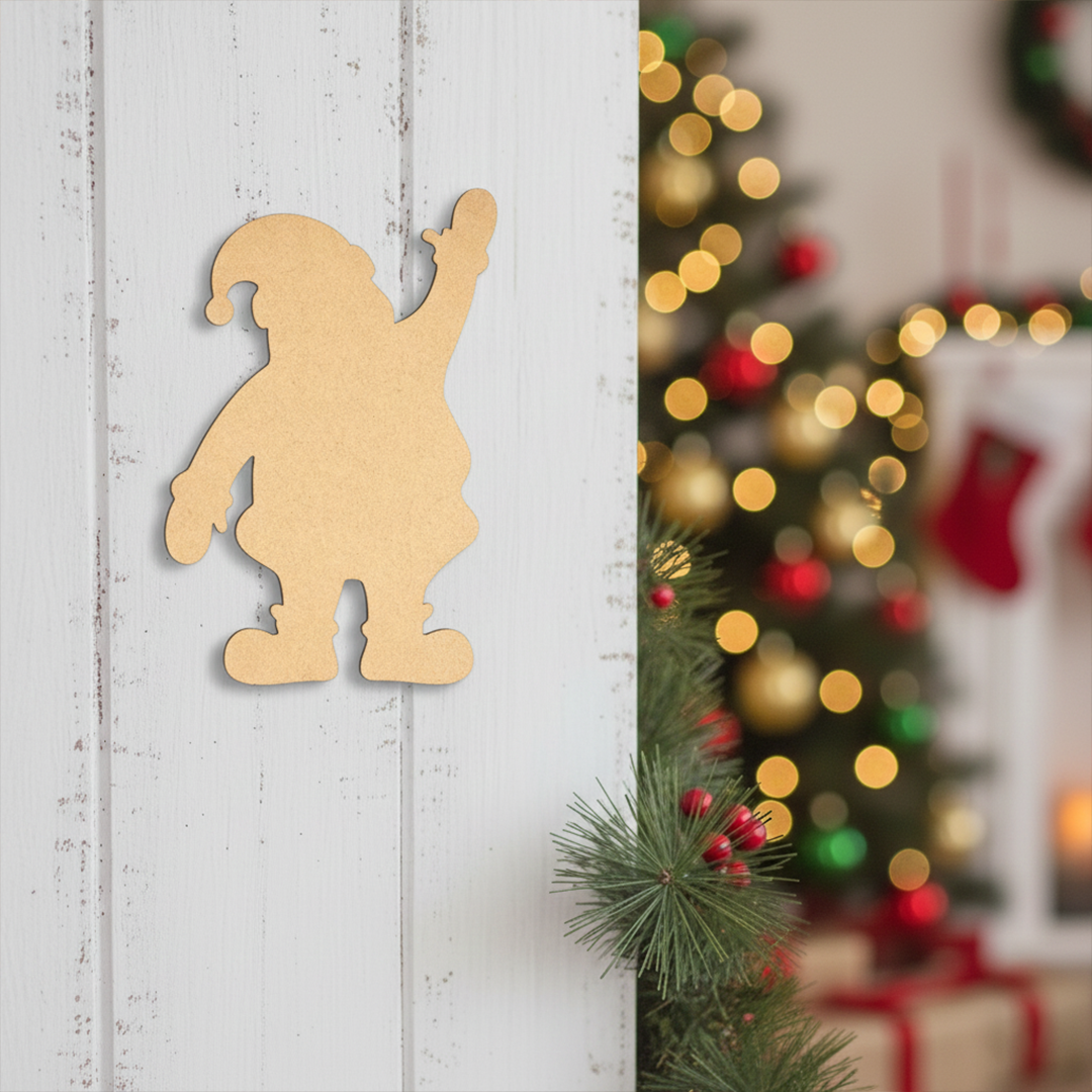 DIY MDF Santa silhouette cutout for painting and Christmas craft decor mounted on wooden wall.