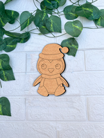 DIY MDF penguin cutout blank with Santa cap for Christmas mount on white bricks wall 