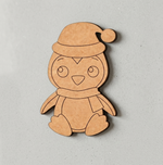 MDF DIY penguin ornament with a Santa hat on a gray background