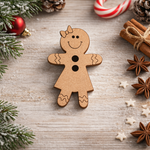 DIY MDF gingerbread girl cutout with bow, smiling face and button details, blank craft shape on decorative table 