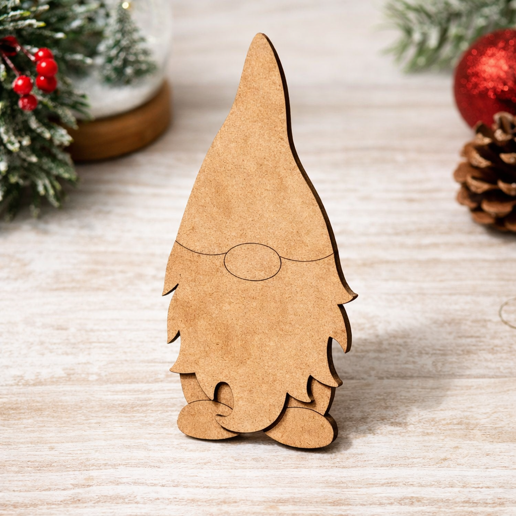 Blank DIY MDF Christmas gnome cutout for painting and decoration standing on decorative table 