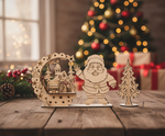 DIY MDF Santa village scene stand with layered house arch and Christmas tree show on decorative table 