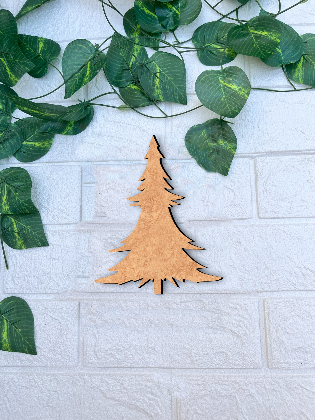DIY MDF Christmas tree cutout for painting and decoration mount on white wall