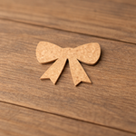 Blank DIY MDF ribbon bow cutout for painting, Christmas gift topper show on table 