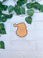 Blank DIY MDF Santa face cutout with hat and beard outline for painting mount on white wall