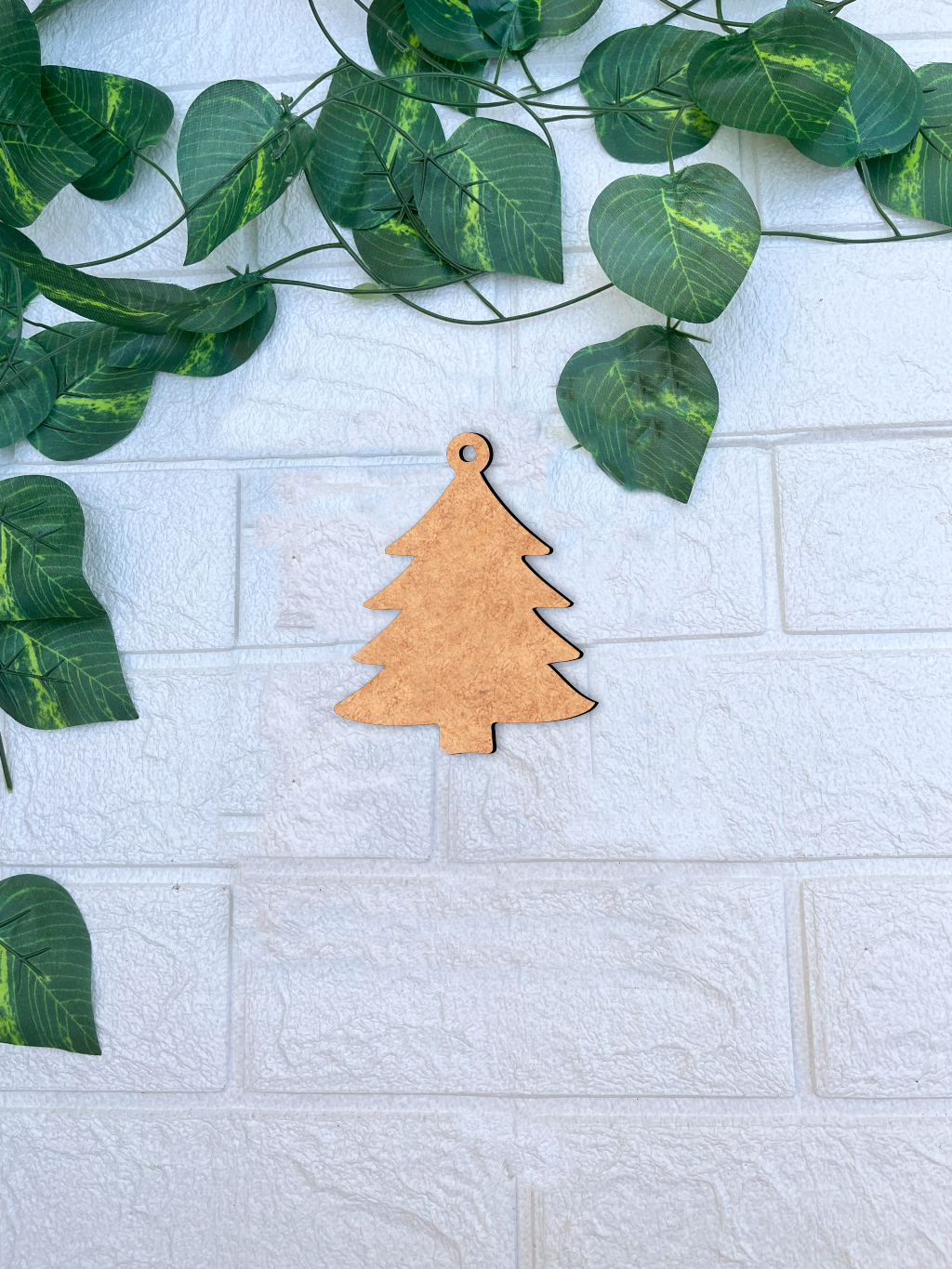 Plain MDF Christmas tree ornament cutout for DIY painting, crafting, and festive decoration mounted on wall