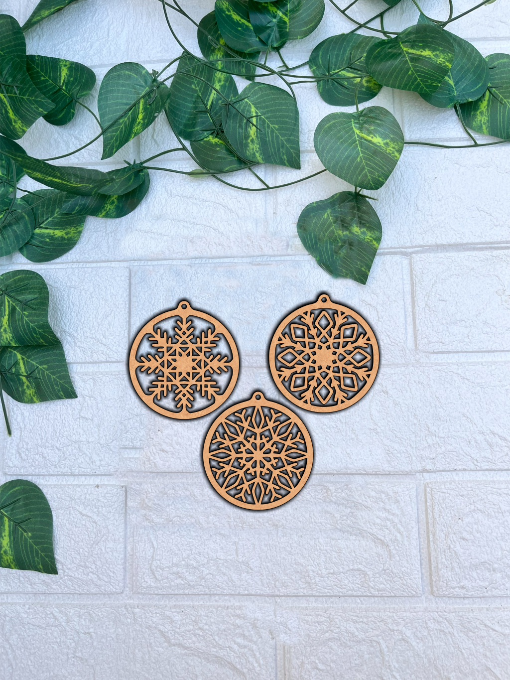 Set of three MDF round snowflake ornaments with assorted cutout designs for DIY Christmas crafts and festive decoration