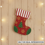MDF Christmas stocking cutout for craft and tree decoration mounted on wooden table 