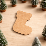 DIY MDF Christmas stocking cutout for craft and tree decoration show on table 