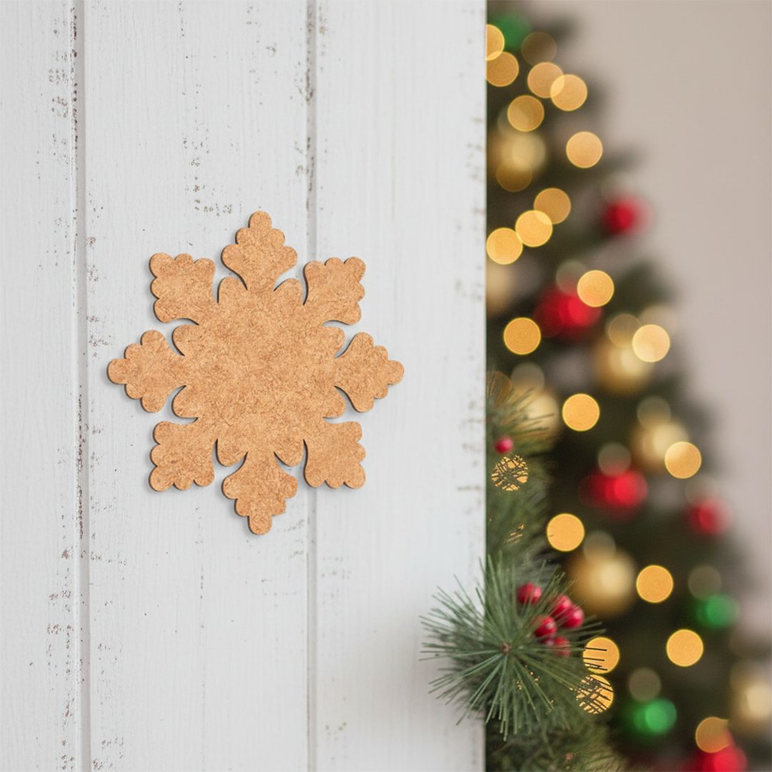 Unpainted MDF snowflake cutout with rounded floral edges, shown on a white wooden wall 