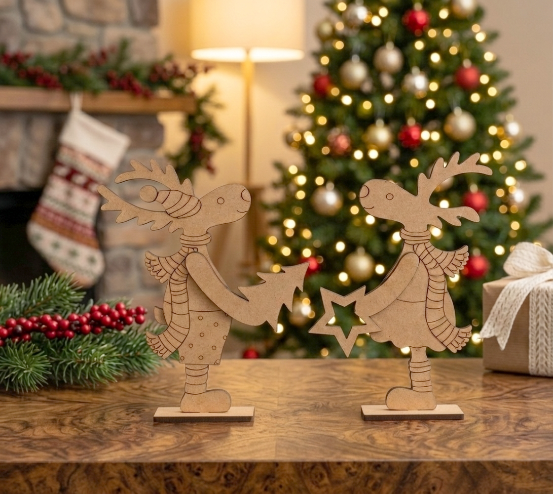 MDF DIY reindeer decorations on a table with a Christmas tree and stockings in the background.