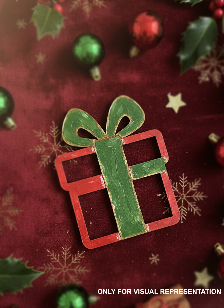 Hand-painted MDF Christmas gift box cutout in red and green, displayed on a festive red holiday background with ornaments and snowflake accents.