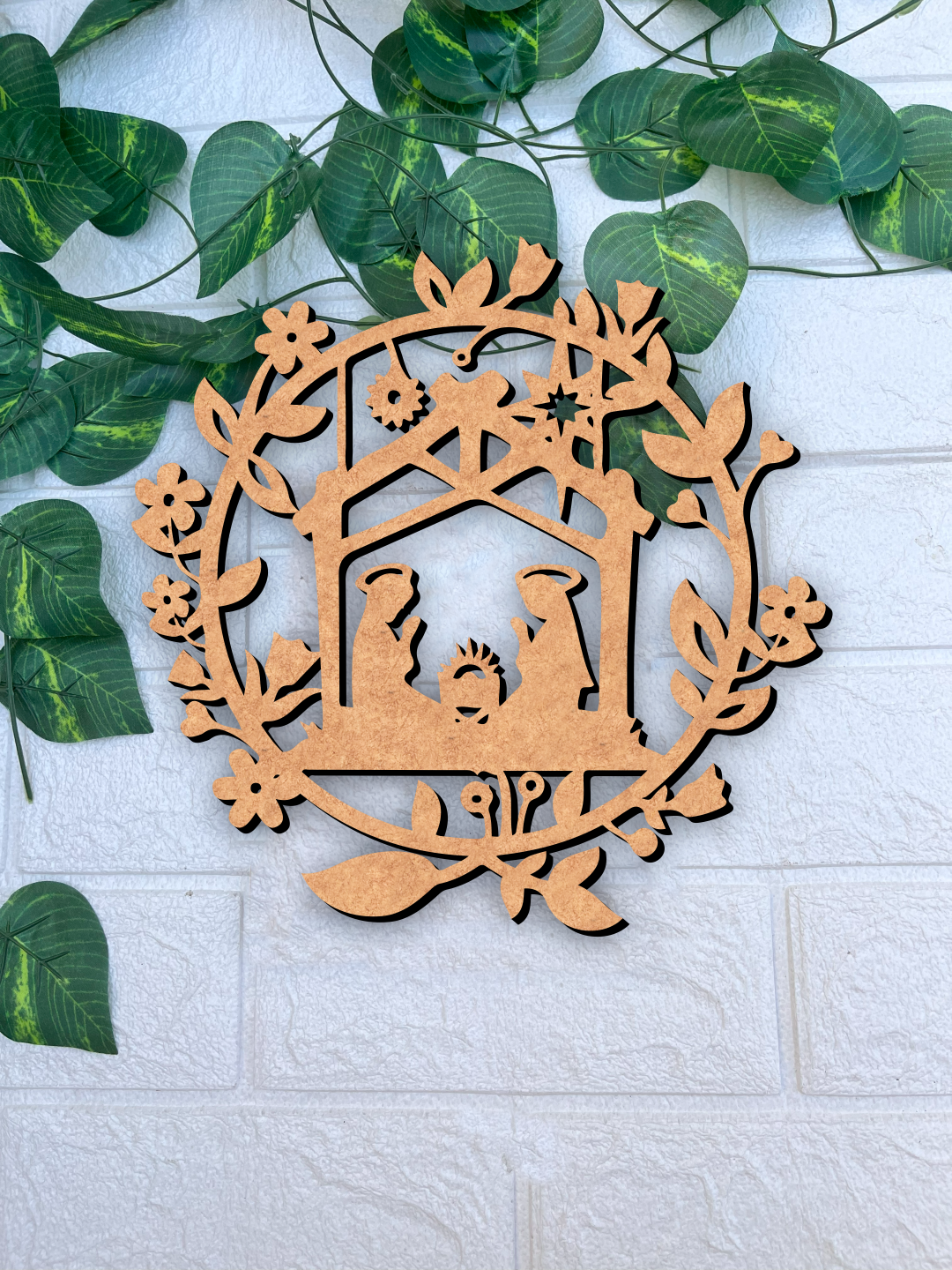 DIY MDF nativity scene cutout ornament for Christmas craft and painting mounted on brick wall