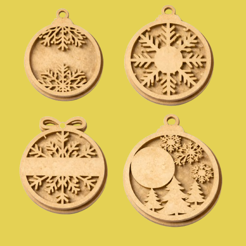 Four MDF DIY Christmas ornaments with snowflake and tree designs on a yellow background