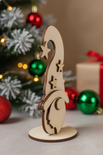 DIY MDF standing Christmas gnome cutout with star hat for craft and painting by side angle with decorative back ground 