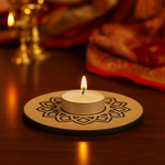 Tea light candle on a decorative wooden coaster with a blurred background with mdf tealight candle holder.