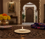 Decorative setting with a lit candle, flowers, and a patterned blanket on a wooden tablewith mdf tealight candle holder.