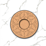 Circular MDF candle stand with floral design on a marble surface.