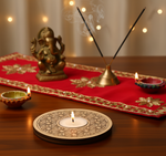 Decorative setup with a statue, candles, and incense on a red cloth with mdf tea light candle holder.