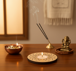 Decorative setup with candles, flowers, and a blue saree on a wooden table with mdf tea light candle holder.