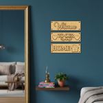Laser cut MDF Welcome Home plank set for DIY wall decor painting, mounted on wall
