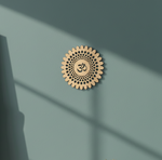 Decorative MDF DIY symbol with Om symbol on a teal wall