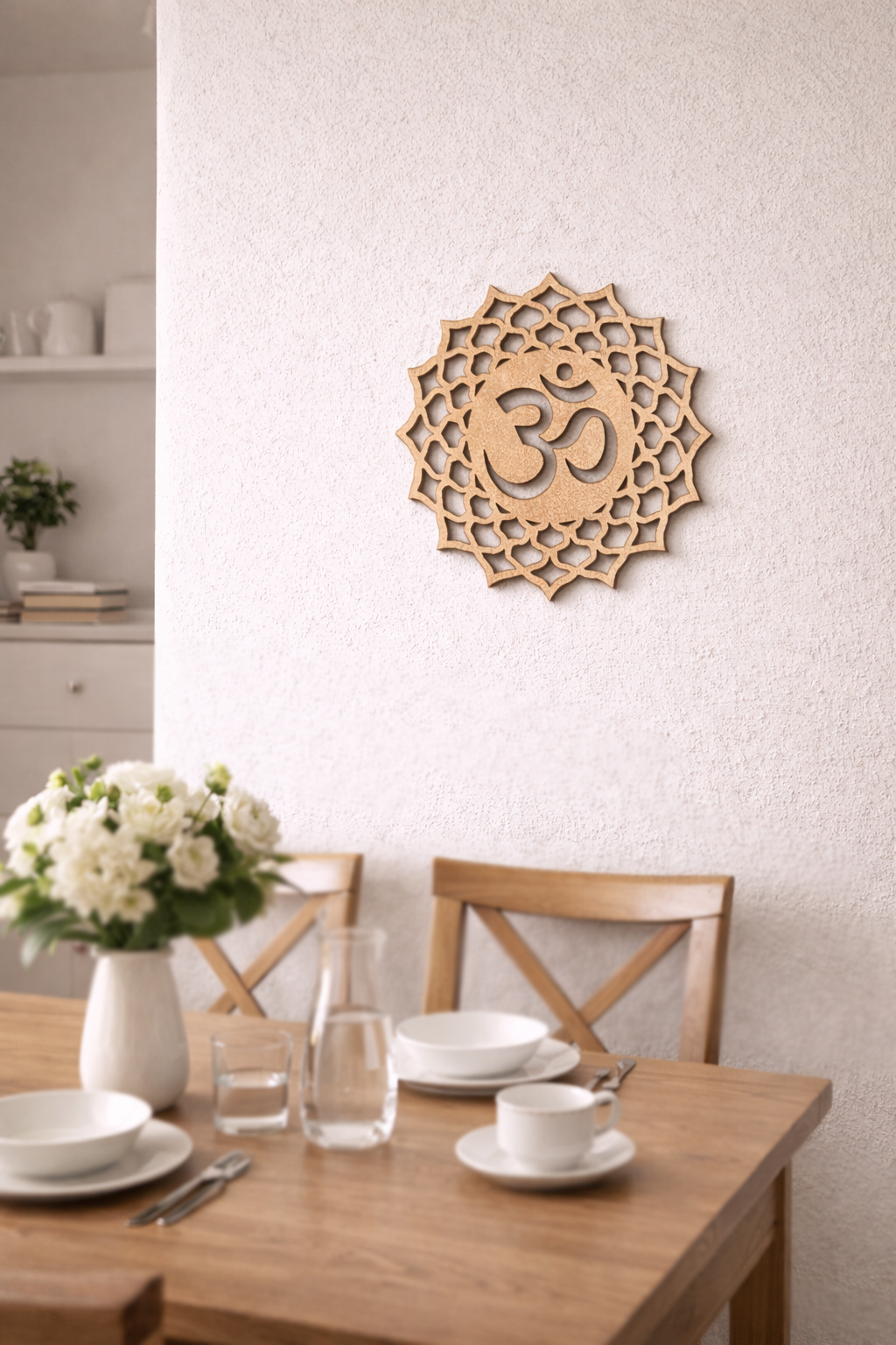 Dining room with wooden table set for a meal, featuring a decorative MDF DIY wall piece with an Om symbol.