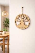 MDF DIY wall decor with a person sitting in a meditative pose on a tree, hanging on a white wall. 