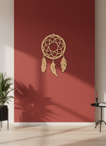 MDF DIY  dreamcatcher wall decor on a red wall with a plant and small table in the foreground.