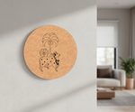 Round MDF DIY wall art  with a design of a cow and palm trees on a wall in a living room.