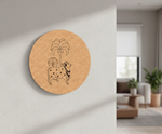Round MDF DIY wall art with a design of a cow and palm trees on a wall in a living room.