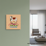 Decorative MDF DIY wall painting of a cow with flowers on a wall in a living room.
