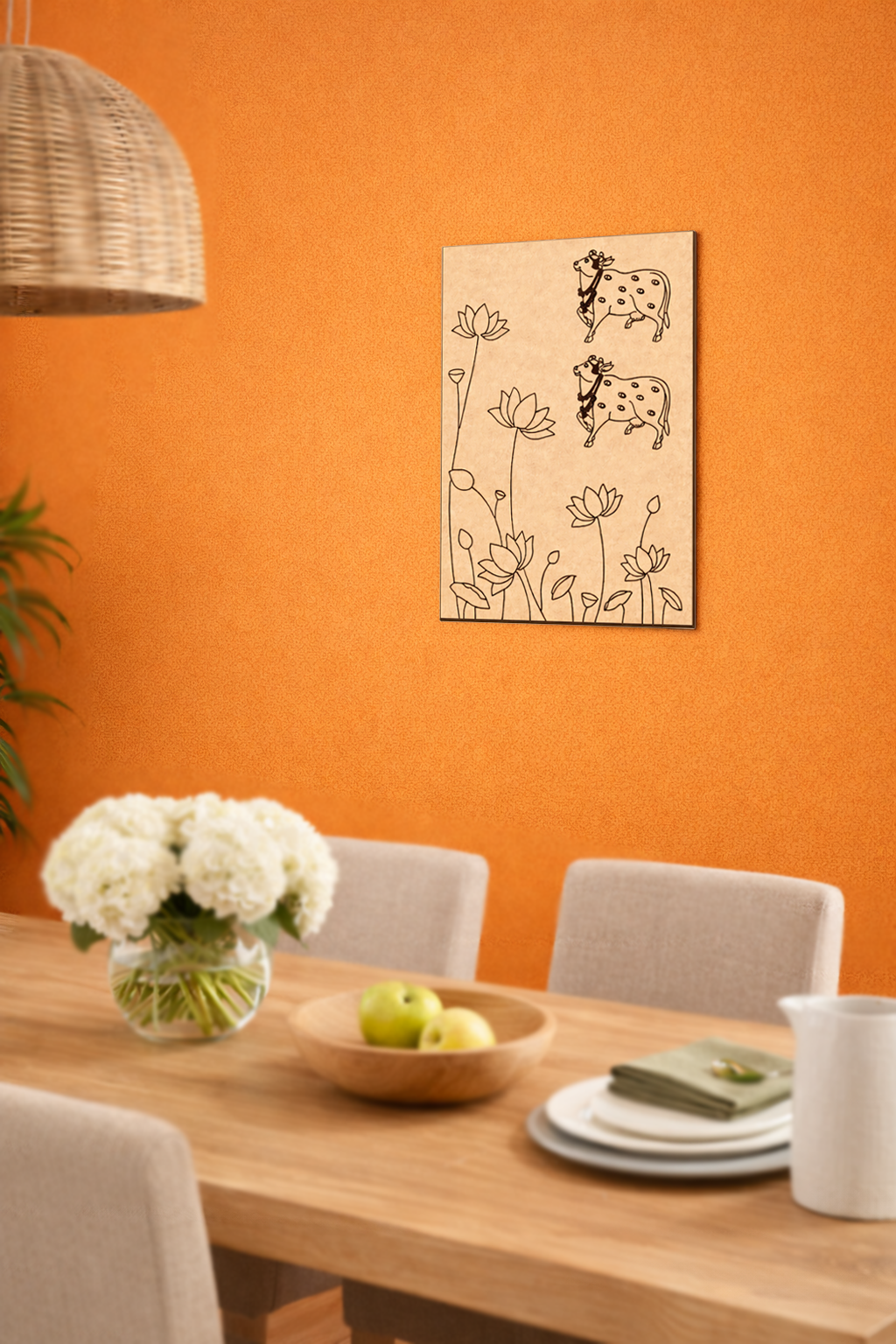 Dining room with an orange wall, wooden table, chairs, and a decorative MDF DIY  wall art piece.