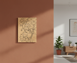 MDF DIY  wall art with floral design on a brown wall, next to a living room with a wooden cabinet and plants.