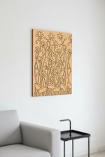 MDF DIY  wall art with floral pattern on a white wall above a gray sofa.