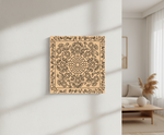 Decorative MDF DIY wall art with floral pattern on a light wall in a modern living room.