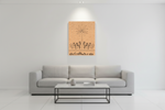 Gray sofa in a room with a wall-mounted decorative piece featuring a star and text.