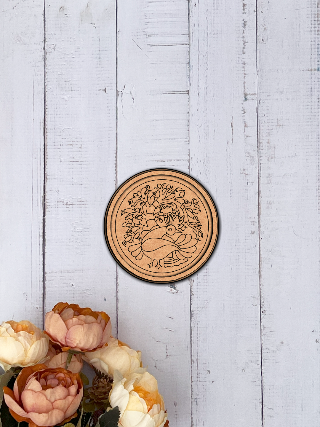 MDF Bordered Pre Marked Peacock Garden Base round board with engraved peacock and floral design hanging on a wooden wall