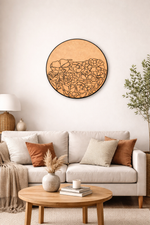 Living room with a beige sofa, wooden coffee table, and decorative MDF wall art.