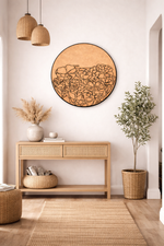 MDF  wall art piece in a room with a console table, plants, and hanging lights.