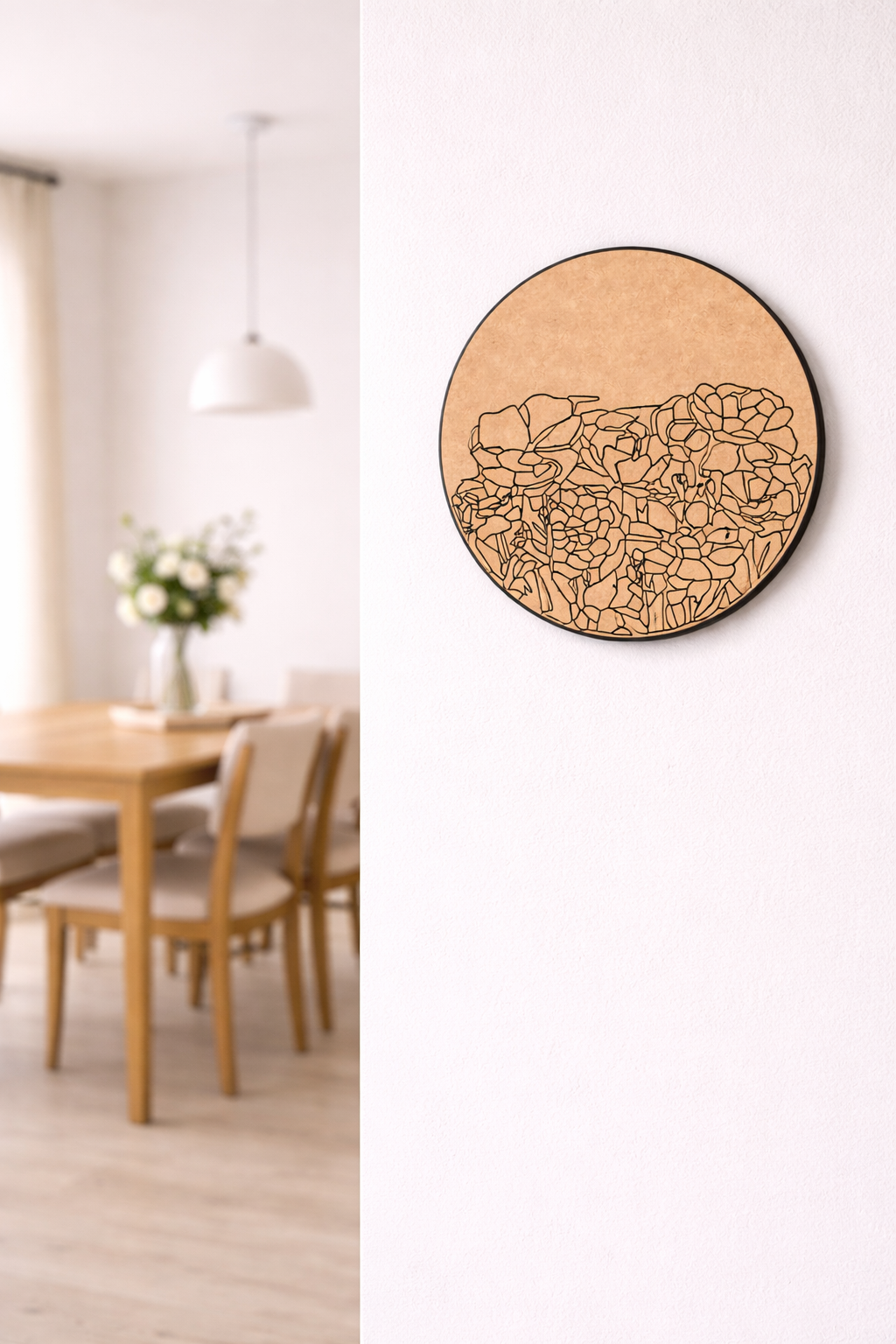 Round MDF wall art piece in a dining room setting