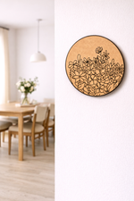 Decorative MDF DIY wall art with floral pattern on a white wall in a room with a wooden table and chairs.