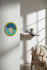 Hand-painted MDF cow and lotus wall art with blue background on white wall.