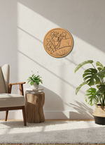 MDF Nandi wall décor on white wall near chair and indoor plants.