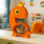 Bright orange dinosaur-shaped coin bank with crown and coins inside