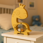 Yellow dinosaur coin bank placed on bedside table with coins