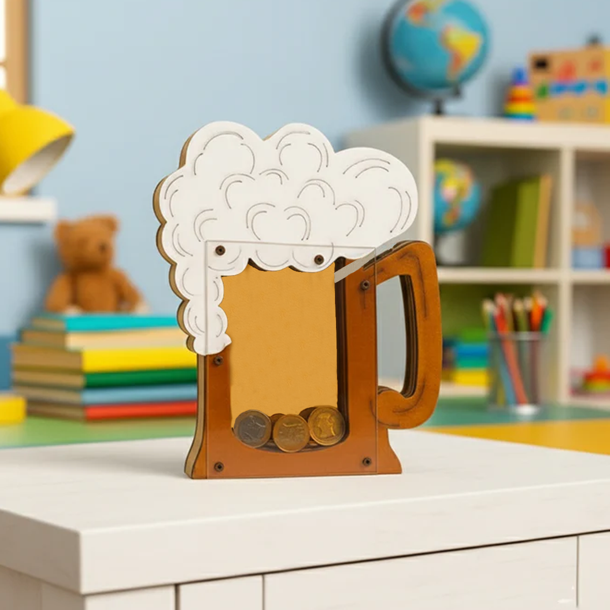 DIY MDF mug shaped money bank with coin slot on a shelf in a room with books and toys.