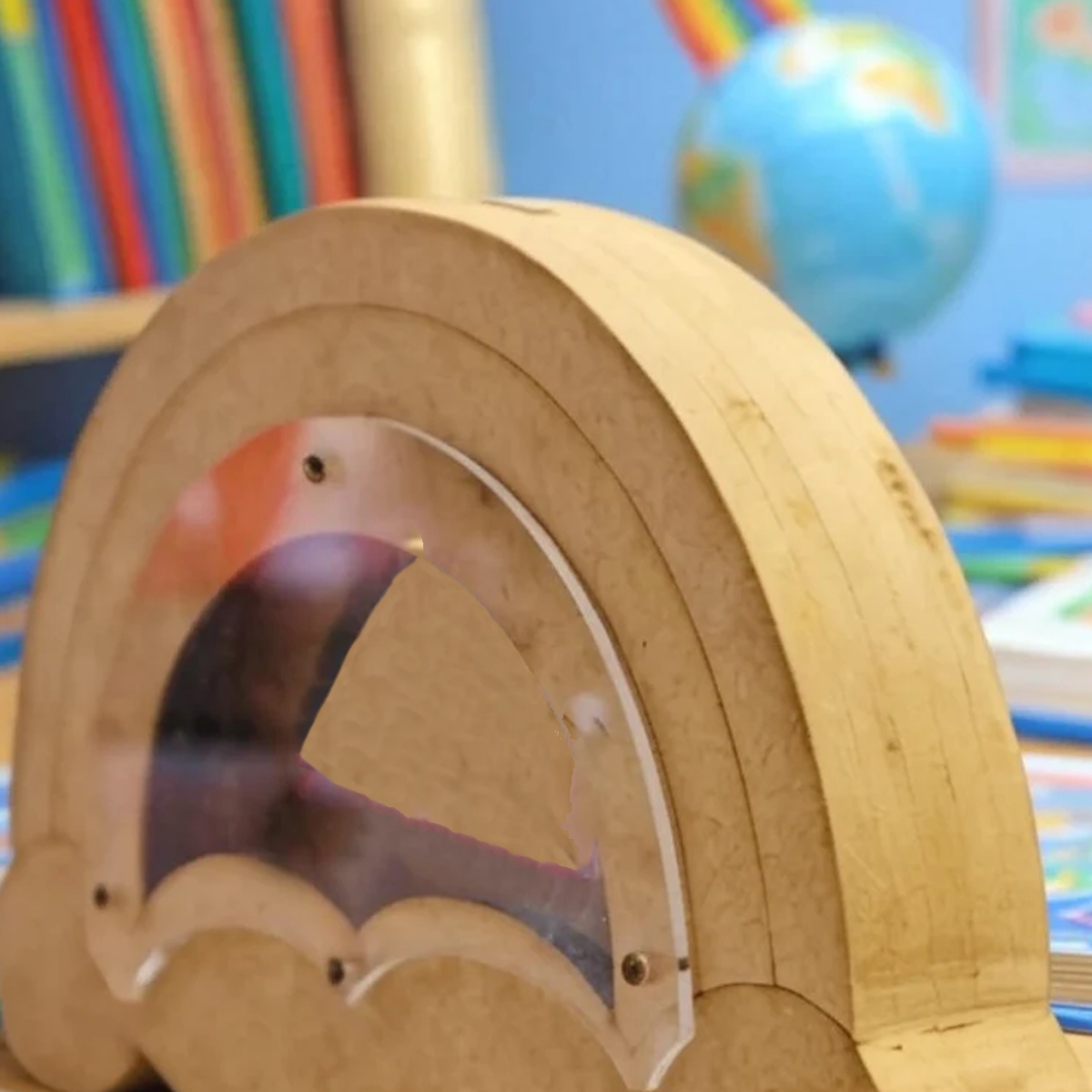 DIY MDF Rainbow shaped money bank 
 in a classroom setting